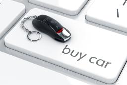 A car key on top of a keyboard